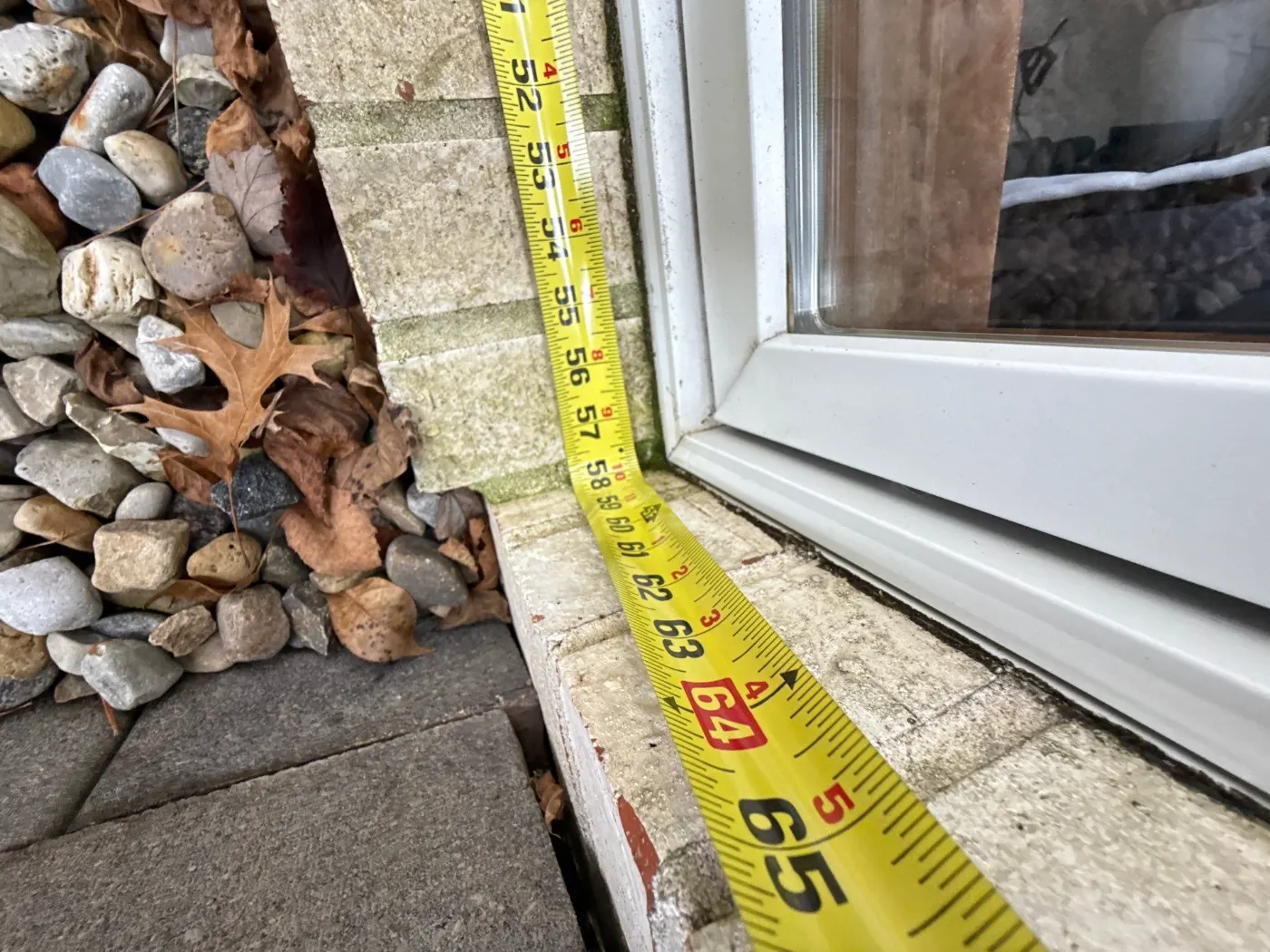 Storm-damaged window documented in Butler-Tarkington